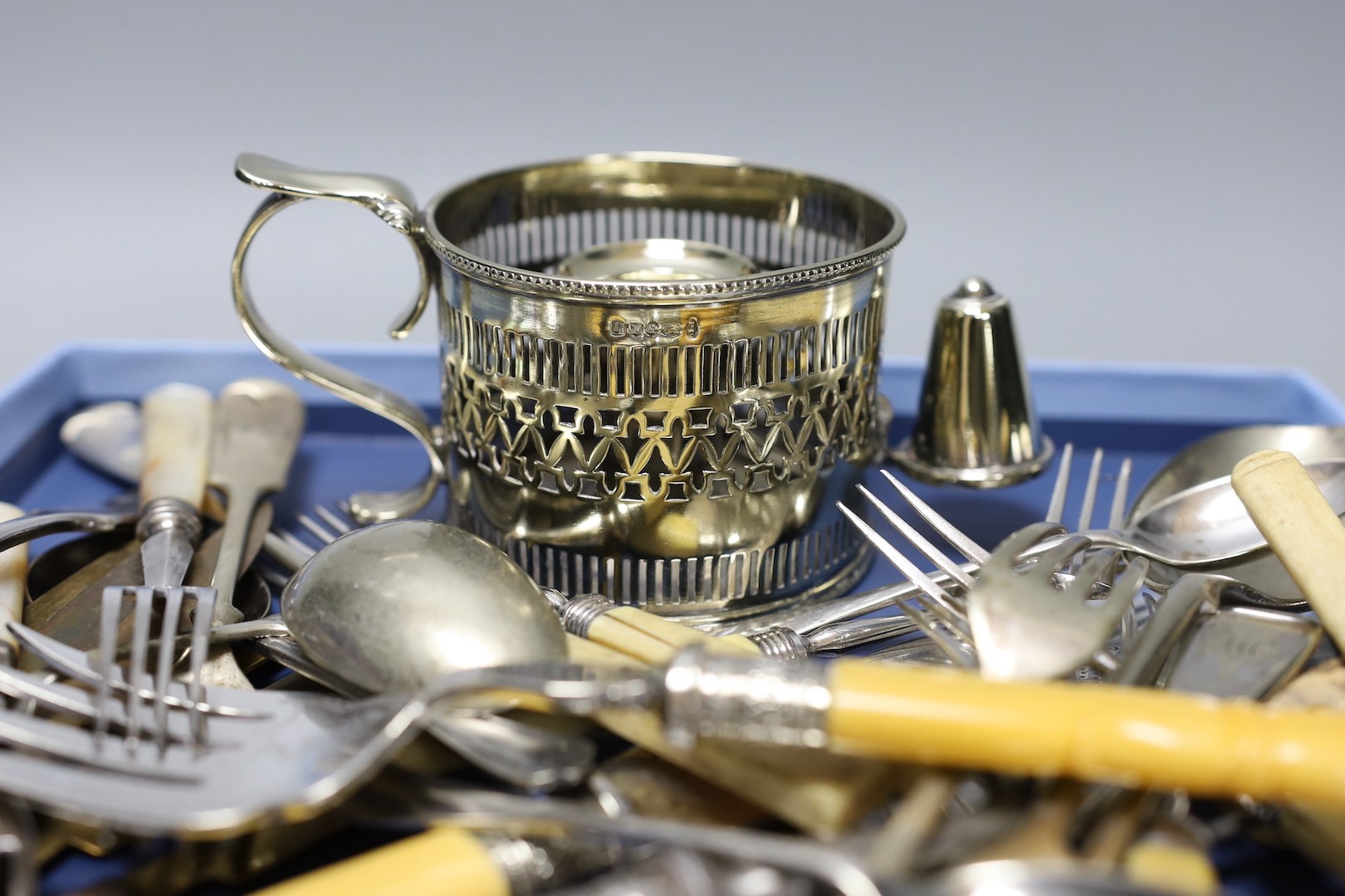 Mixed plated items including chamberstick, pair of fish servers, plated soup ladle and other flatware.